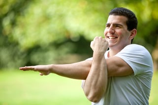 Handsome man stretching at the park - fitness concepts Handsome man stretching at the park - fitness concepts